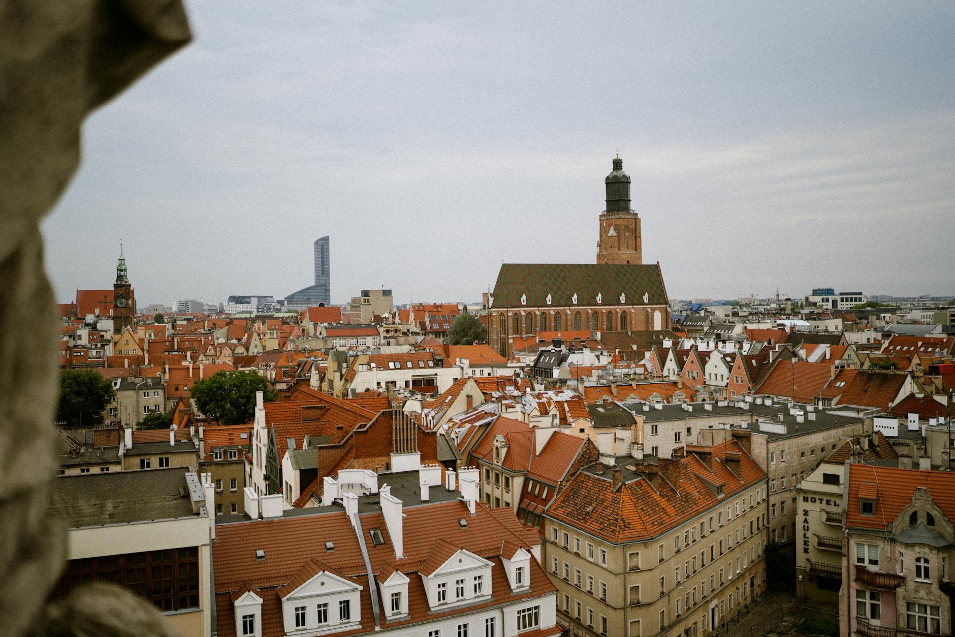 Explore the charming rooftops and historic architecture of Wroclaw, Poland, showcasing St. Elizabeth's Church.